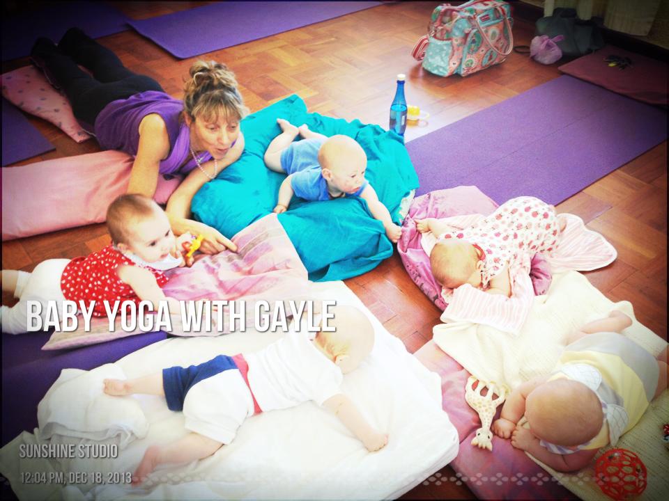 A postnatal baby yoga class with babies on mats